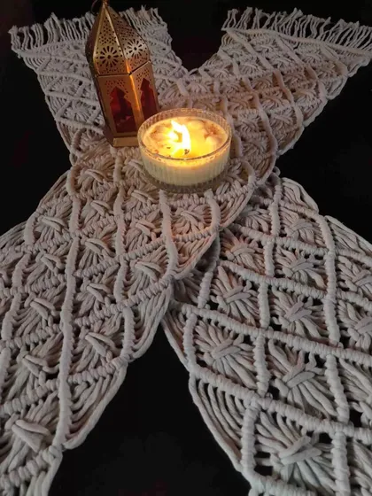 Another view of our macrame table mat, perfect for creating a warm and inviting tablescape. The natural cotton material adds a lovely, rustic texture.
