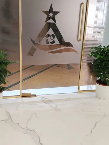 Two elegant Ficus plants in classic white pots create a symmetrical and welcoming entrance to this office. Placing plants at doorways is a simple yet effective way to make a positive first impression on clients and employees alike.