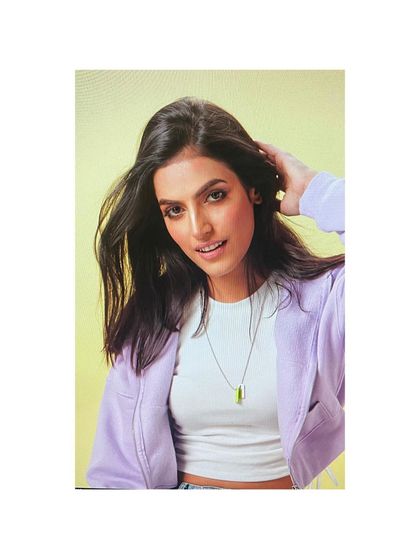 This is another shot from the same Oriflame project, featuring a lilac jacket. The styling is simple and clean, focusing on a bright, accessible look for the beauty brand.