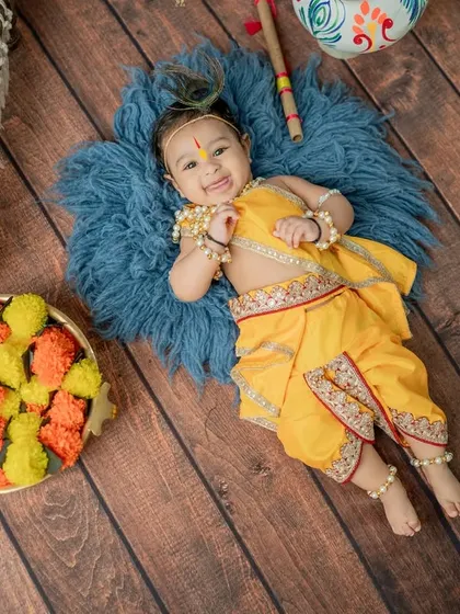 A beautiful overhead shot capturing a big, happy smile from our little Krishna.