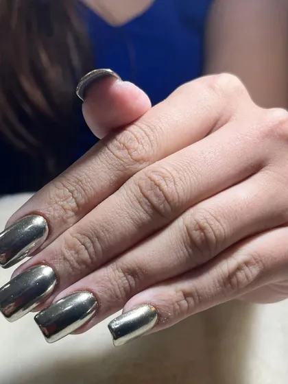 A side view of the silver chrome nails, showing the perfectly smooth and reflective surface that I achieve with this technique.