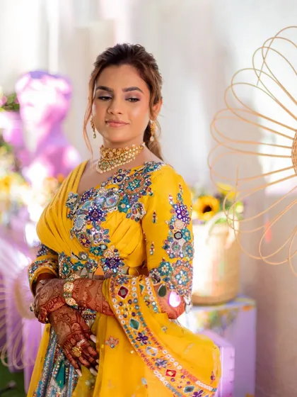 A poised shot of the bride at her Haldi ceremony. The entire look is vibrant and full of life.