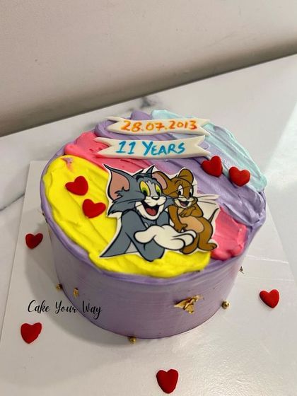 A cake that brings out the kid in everyone. A fun and colorful Tom and Jerry cake for an 11th birthday.