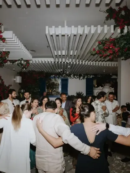 Guests and performers join in a traditional Greek dance. I believe in creating inclusive experiences where everyone feels part of the celebration and the chosen theme.