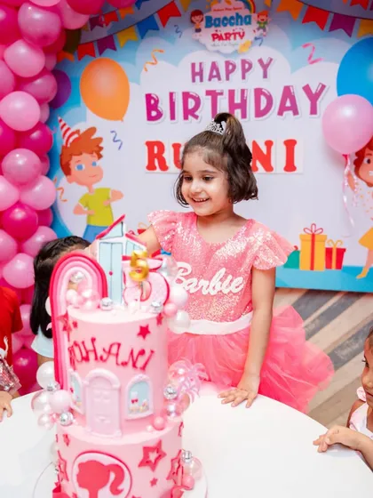 The birthday girl with her Barbie dreamhouse cake! Seeing smiles like this is the best part of my job.