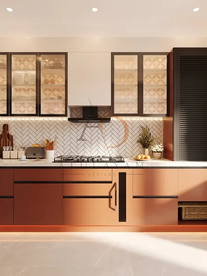 A sleek and sophisticated kitchen in a warm rust tone, featuring a herringbone tile backsplash, handleless lower cabinets, and glass-front upper cabinets.