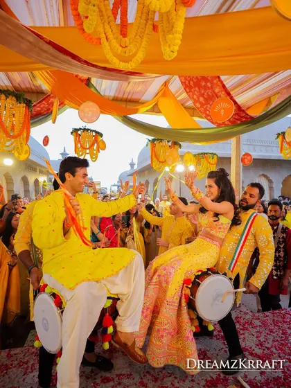 The couple takes center stage on dhols during their Haldi. I incorporate unique entertainment elements to make every ritual more interactive and memorable.