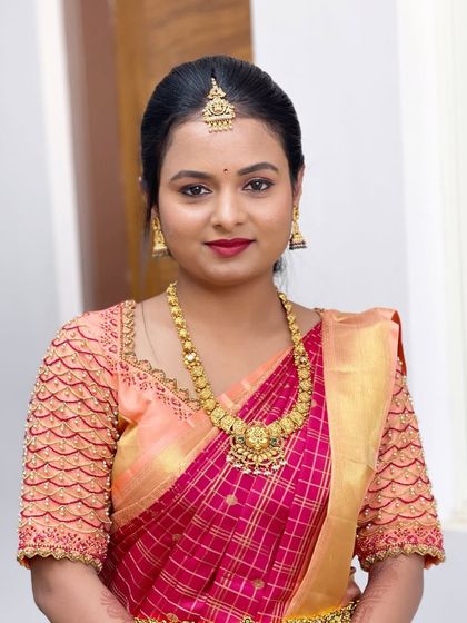 A portrait of Divya, showing her complete look. The makeup is fresh and enhances her natural beauty.