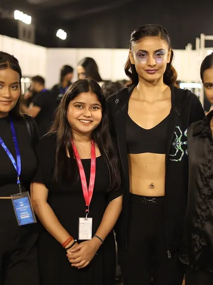 Real-world experience is not optional here; it's part of the curriculum. My students are pictured here backstage at a major fashion event, working with professional models. This is the kind of invaluable, hands-on industry exposure that builds your confidence and your professional network.