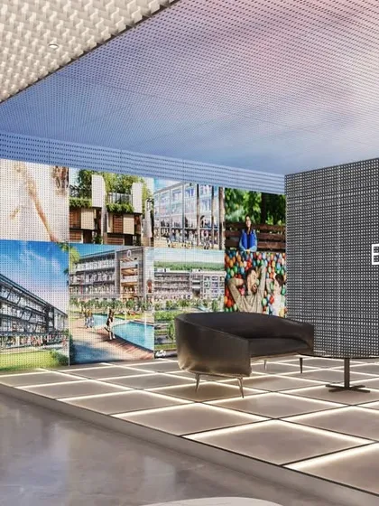 For AU Real Estate's office, we designed an immersive experience zone. This area features large-scale LED screens displaying project visuals, creating a high-tech, engaging environment for clients to explore the firm's work.