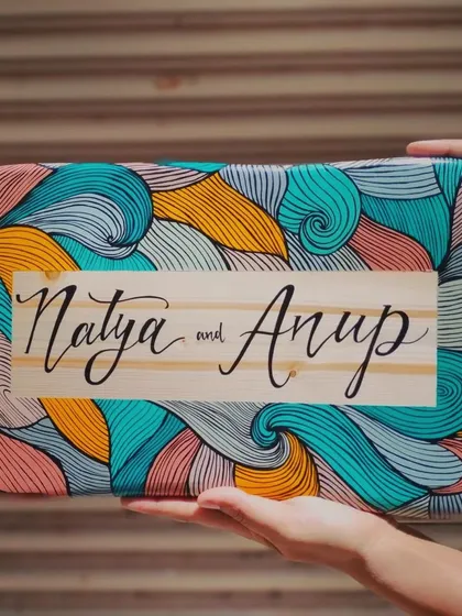 A duplicate of 167, we love how this boho-inspired name plaque for "Natya and Anup" turned out. The natural wood grain contrasts beautifully with the colorful, intricate line art.