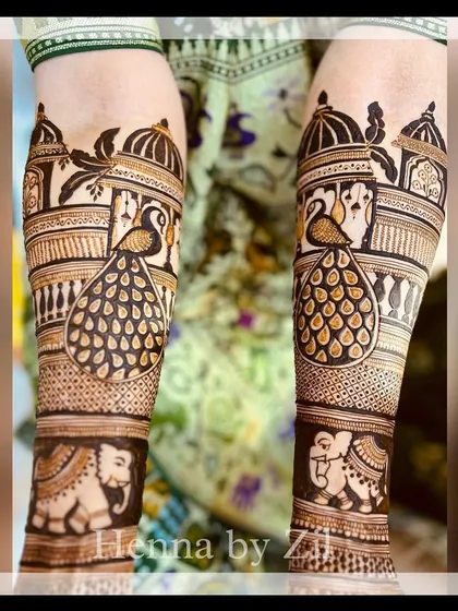 A classic design with peacocks perched on jharokhas and elephants below, creating a multi-layered traditional look.