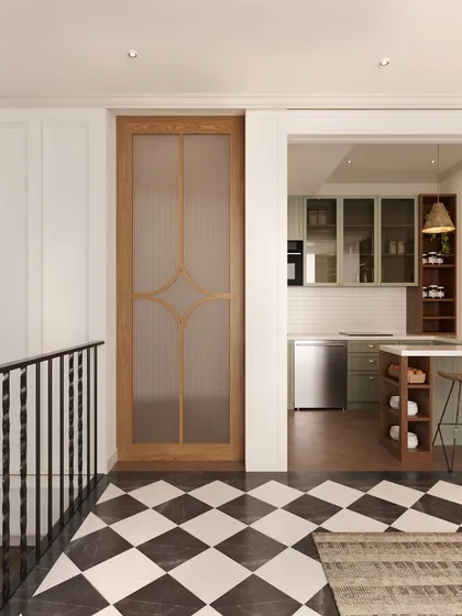 This view shows the lounge's proximity to a compact kitchenette, separated by a custom wooden door with a frosted glass panel. This design creates a functional and convenient multi-use space for the family on the upper level.