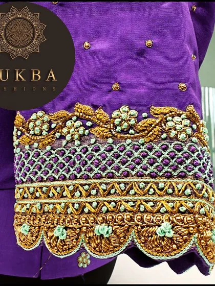 A close-up of a purple blouse sleeve cuff. This detail shot shows the intricate lattice work, zardosi, and scalloped edging that define my craft.