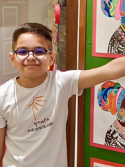This young artist, standing proudly by his work in his Prath t-shirt, perfectly captures the spirit of our studio. We are a community that creates and celebrates together.