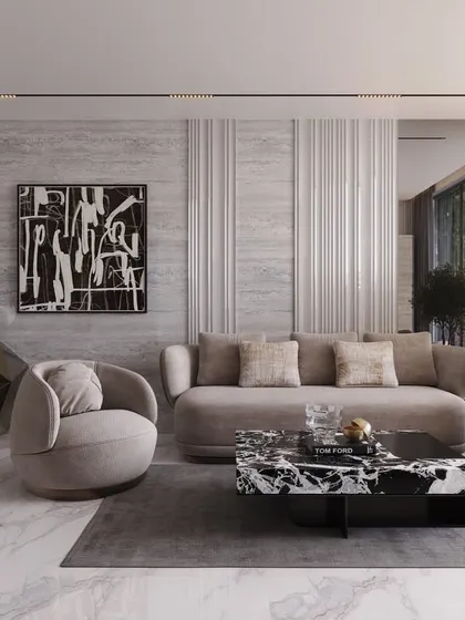 This living area combines geometric forms with soft textures. A faceted console and a striking black-and-white coffee table are balanced by plush, curved seating, creating a space that is both modern and comfortable.