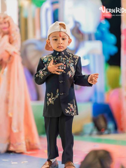 A modern twist on tradition. This little client is rocking our bestselling embroidered Indo-western jacket with a cap for his mundan ceremony, showing how versatile our pieces can be.