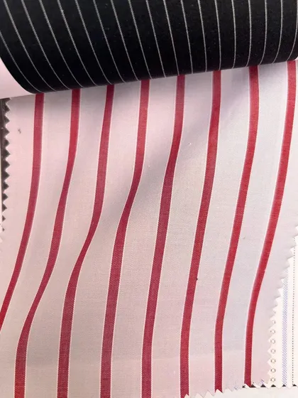 A reversible fabric with bold red and white stripes on one side and black and white on the other, offering unique possibilities for custom design.