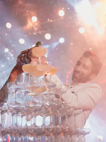 A celebration is about creating moments of pure joy. This champagne tower was the sparkling highlight of a glamorous cocktail night, bringing everyone together for a toast to the happy couple.
