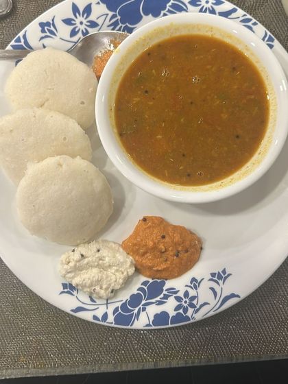 Soft, fluffy idlis with sambar and chutneys. This classic South Indian breakfast is a great low-fat, fermented option that I often include in my diet plans.