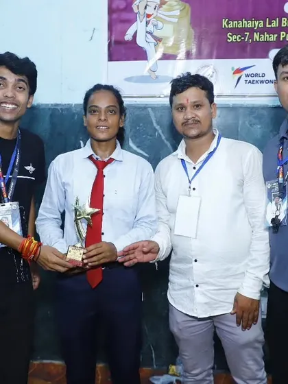 Our senior female athlete receiving the 'Best Fighter' trophy at the Vijay Cup.