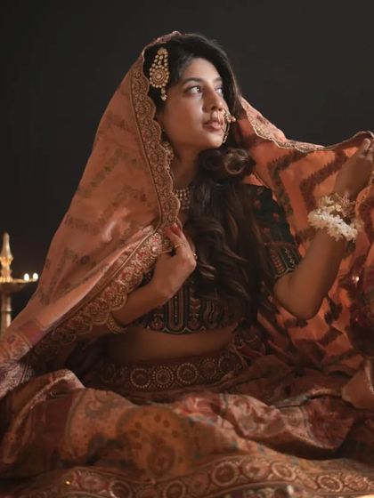 Another beautiful shot of our Heeramandi-inspired lehenga. The way the dupatta is draped adds a touch of old-world charm and elegance.