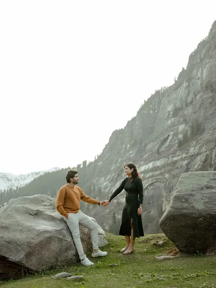 A stylish portrait set against the majestic mountains of Manali. The couple's connection is the focus, framed by the grandeur of the Himalayan landscape.