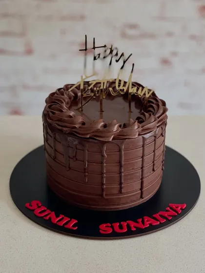 A rich chocolate drip cake for a joint birthday celebration. Sometimes, all you need is pure, decadent chocolate.