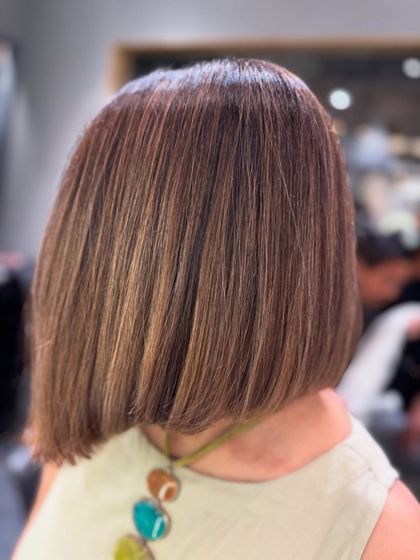This image shows why color looks so attractive on short hair. The added body and texture from this brown balayage beautifully enhance the bob haircut.