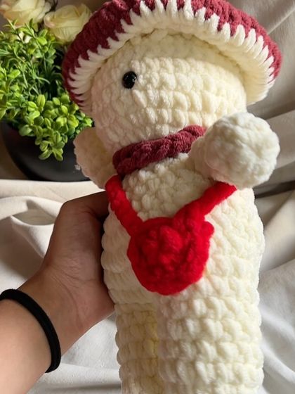 Another look at our mushroom-man plushie. Every toy we make is handcrafted, ensuring that each one is a unique piece of art.