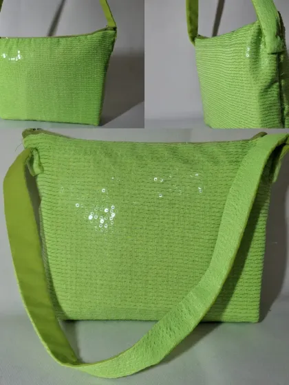 I also work with other recycled materials. This vibrant green bag is made from upcycled sequined fabric, turning an old party dress into a fun, everyday accessory.