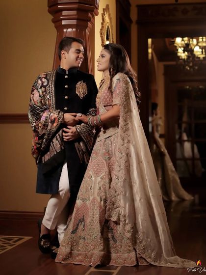 A full length portrait showing the couple's elegant outfits and their comfortable, loving posture. We guide our couples into poses that feel natural and look beautiful.