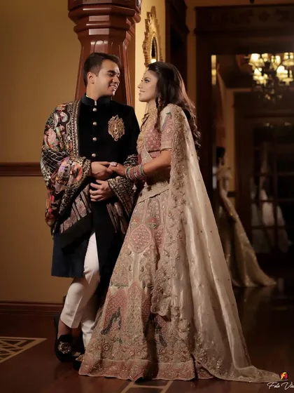 A full length portrait showing the couple's elegant outfits and their comfortable, loving posture. We guide our couples into poses that feel natural and look beautiful.