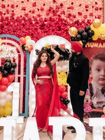 A candid moment of the parents dancing at their child's first birthday party. It's a celebration for the whole family, and I capture that joy.