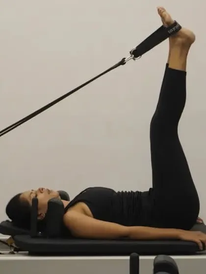 Another angle of the feet-in-straps series, showing the legs in a "frog" position. This targets the inner thighs and lower abs.