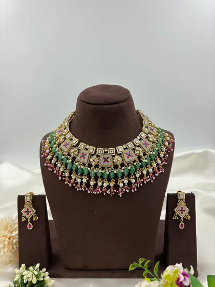 The full Divya antique gold necklace set displayed for a complete view.