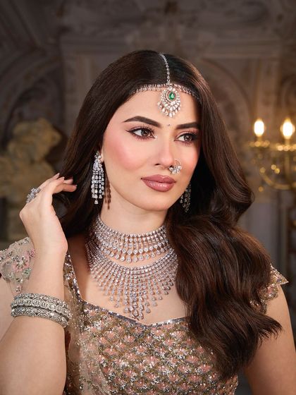 Another beautiful portrait showing the harmony between the makeup, the diamond jewelry, and the soft pastel outfit.