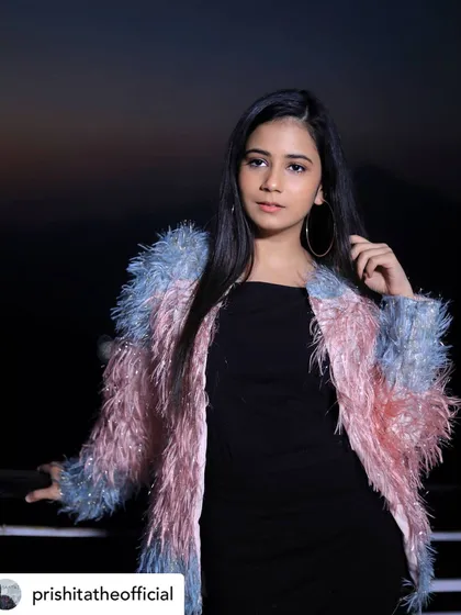 A portrait of singer Prishita in an outfit I styled for her music video 'Hawa Mein Yun'. The pastel-colored jacket was chosen to give a dreamy and youthful feel.