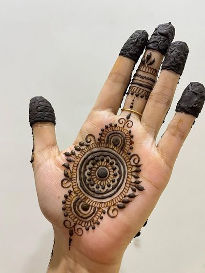 A simple mandala design with a solid center, perfect for a quick and elegant look.