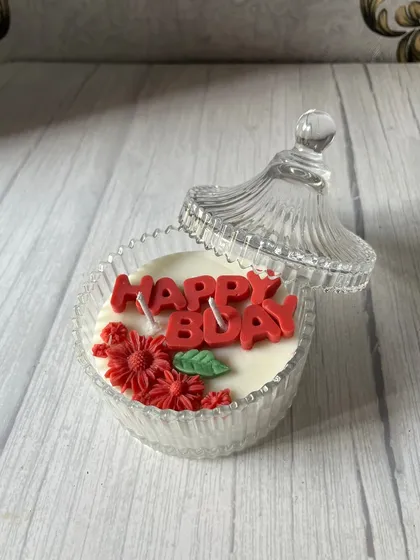 Our "Happy Bday" candles are a fun and festive gift. This one is set in a crystal jar and decorated with red floral wax embeds.