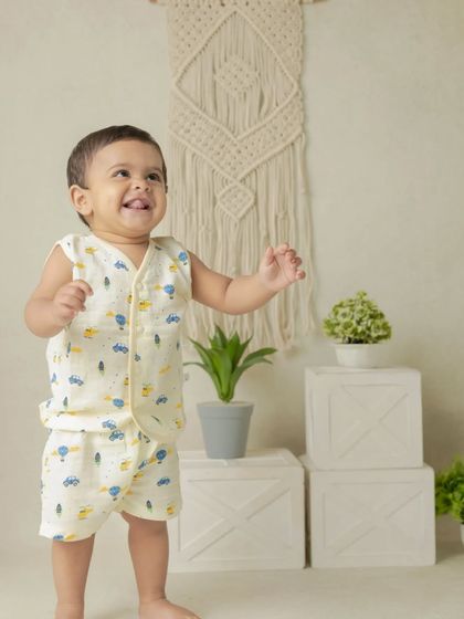 My boho-themed sessions use natural textures like macrame, wood, and greenery to create a calm and earthy setting that beautifully complements your child's simple joy.