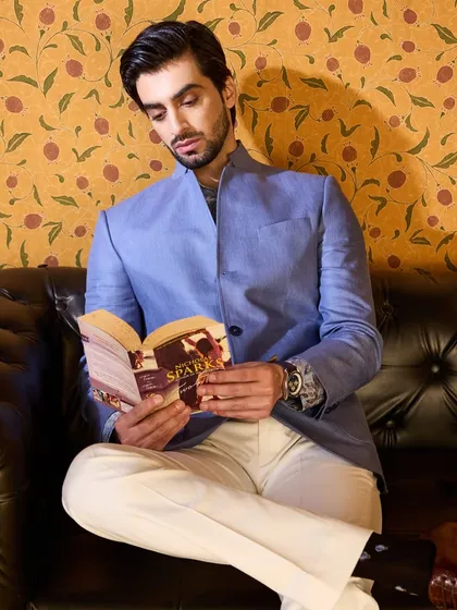 Even in a quiet moment, style speaks volumes. This linen jacket is perfect for a guest who values both comfort and sartorial elegance.