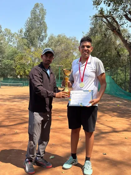 The winner of our Amateur Tournament proudly holding his trophy. It's all about playing, learning, and growing together as a community.