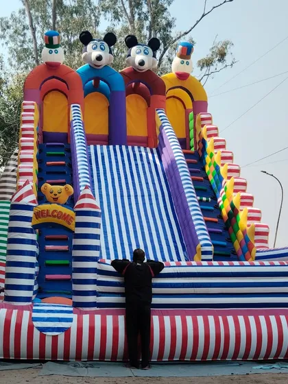 A different 3-lane slide design with a striped pattern. You can see one of my team members doing a final check, as we do for all our products.