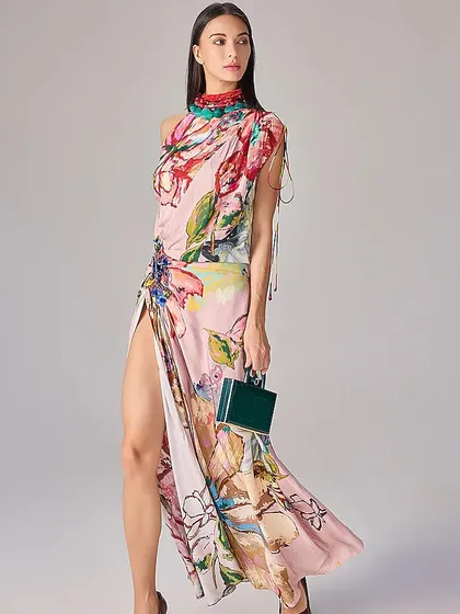 A full-length shot of the printed dress, showing off the high slit and the way the fabric flows, creating a look that is both elegant and daring.