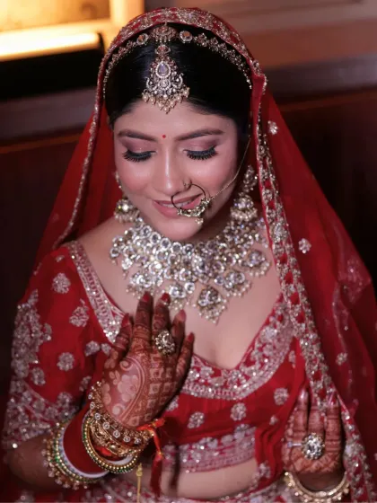 A close-up of the bride's soft and shimmery eye makeup. The rosy cheeks and defined eyes create a look that is both traditional and fresh.