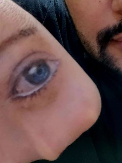 Sometimes, the canvas is unconventional. Our instructor demonstrates hyper-realistic drawing by painting an eye on his own hand, a fun and inspiring moment in the studio.