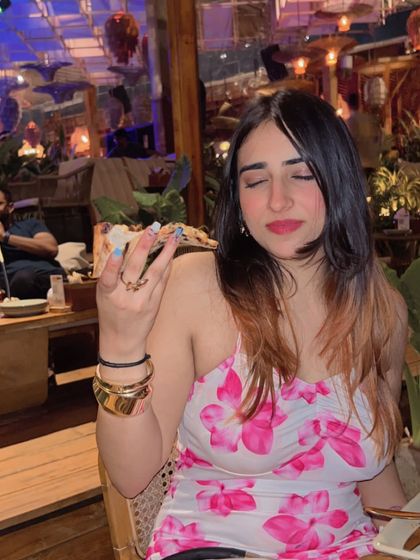 A playful "peace sign" pose while enjoying a meal. This adds a touch of fun and personality to my content.