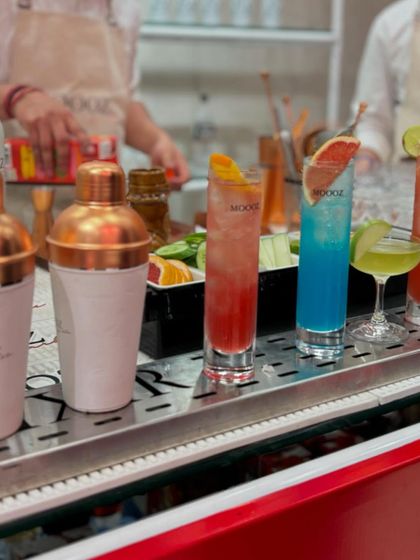 A lineup of colorful and refreshing cocktails crafted for the Diesel x Moooze collaboration. The bar setup was a central feature of the event, serving bespoke drinks to guests.