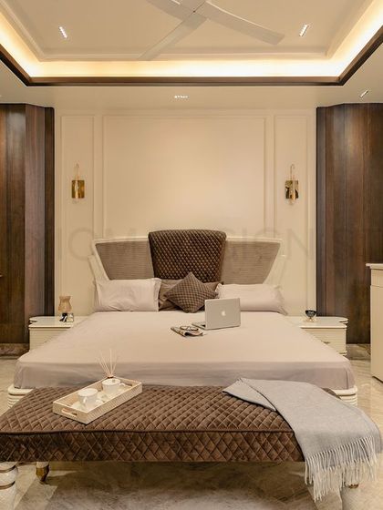 This parent's bedroom was designed around the client's specific vision. The walls are kept simple, allowing the intricately designed custom furniture and rich textures to stand out.